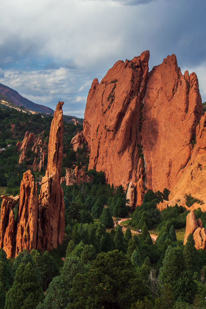 Some spires and large red rock walls, the trail at the bottom