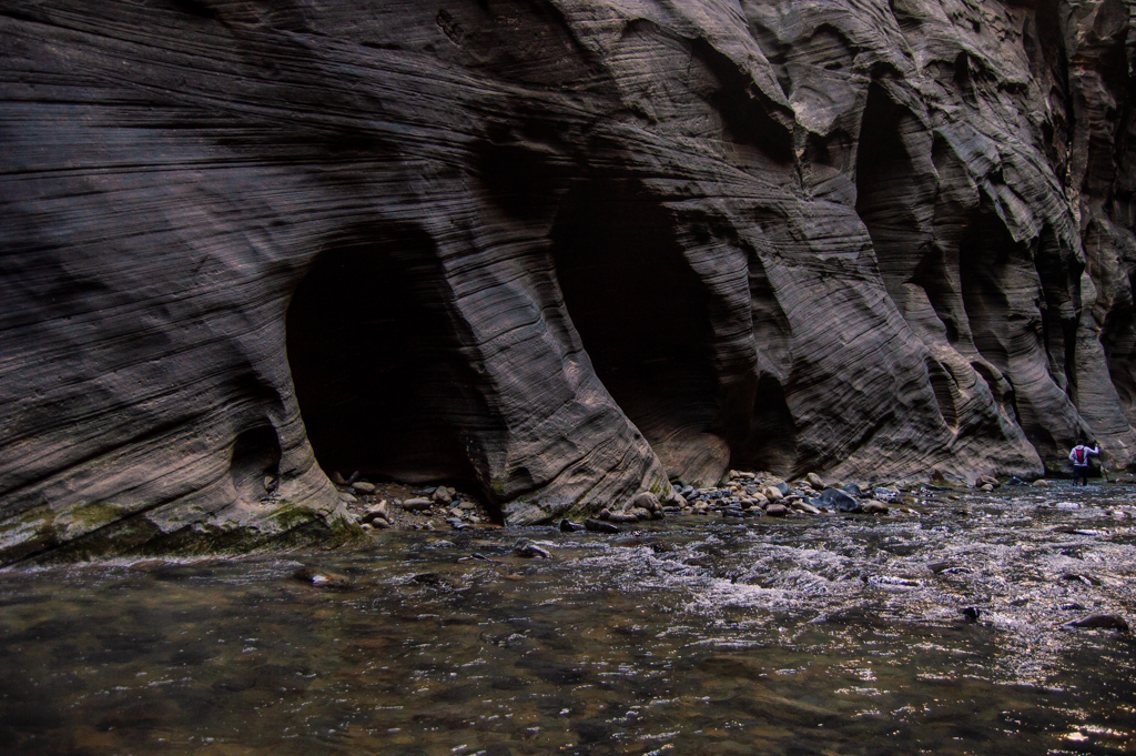 River canyon walls with visibly deep grooves cut from water erosion