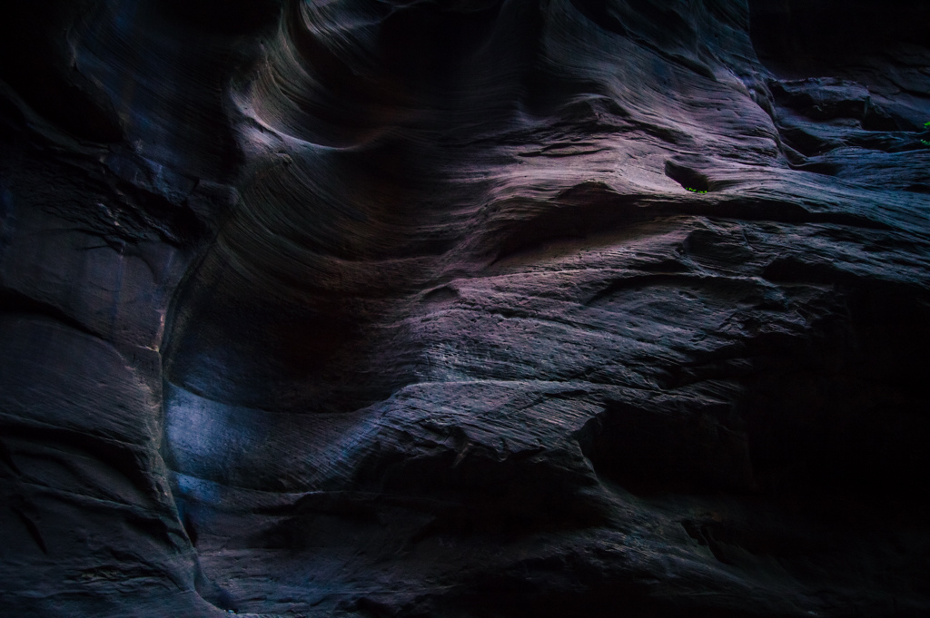 A soft light on purple canyon walls