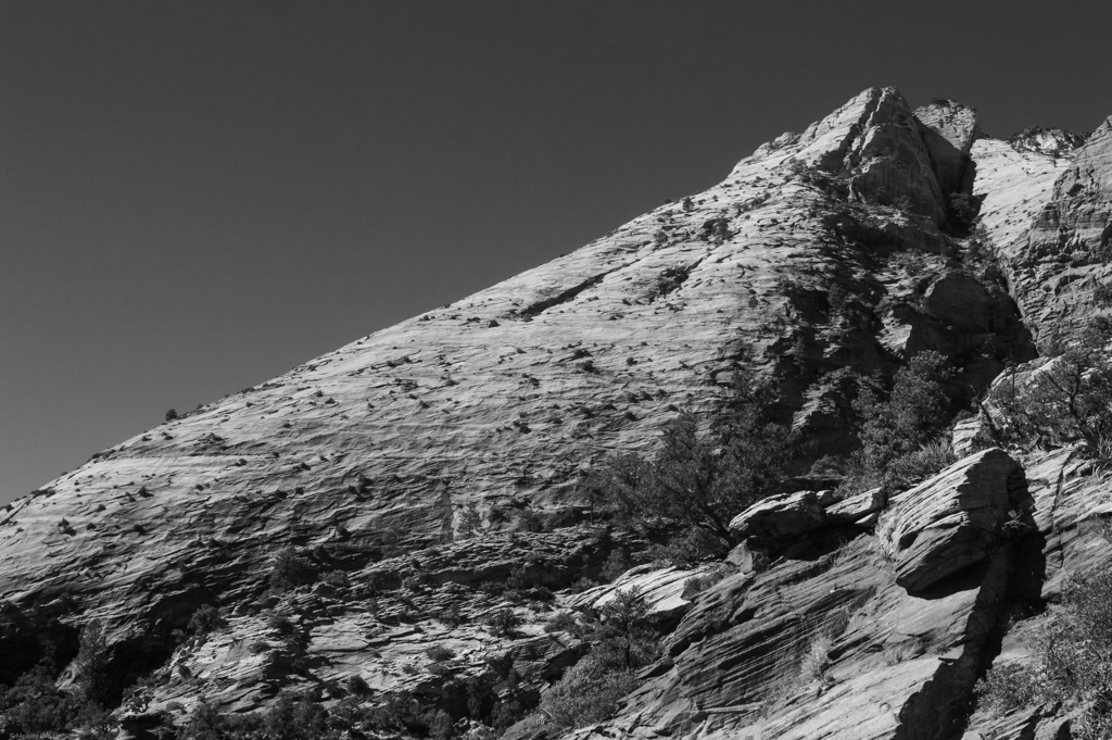 A black and white photo of a mountain with 45-degree slopes