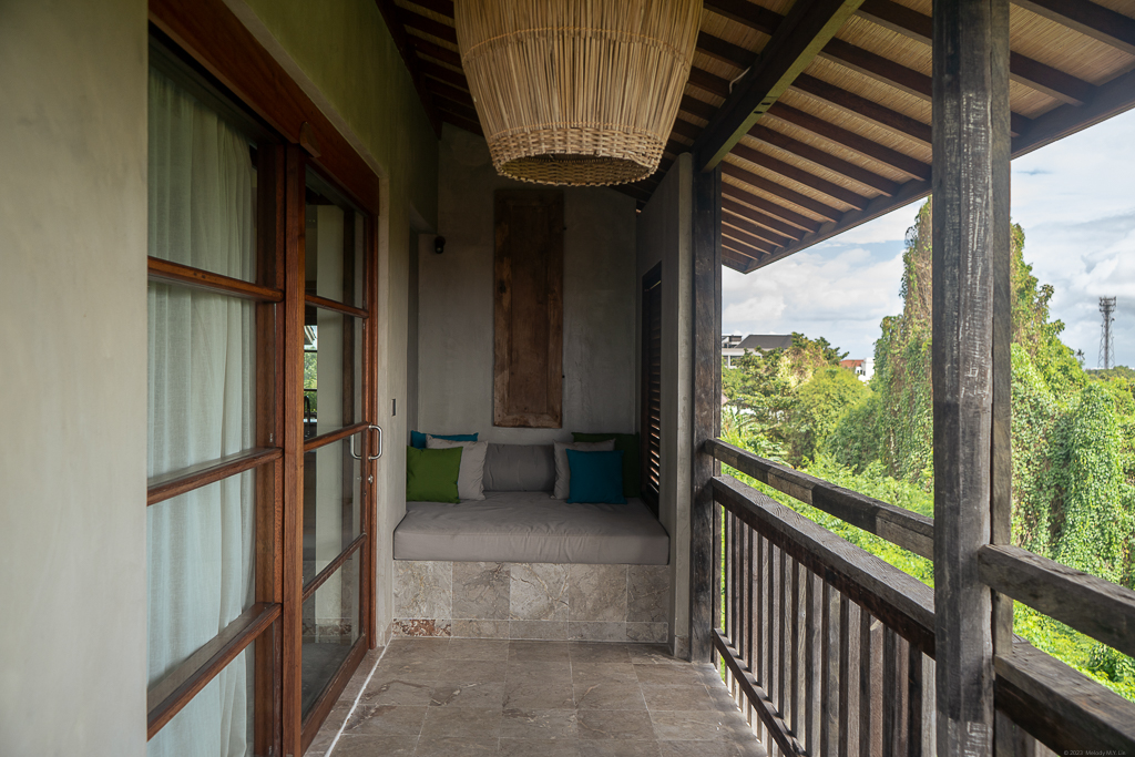 A balcony with a daybed