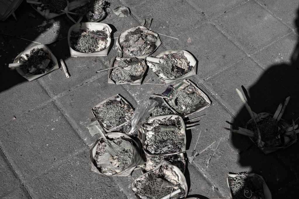 Canang sari (offerings) all along the sidewalks