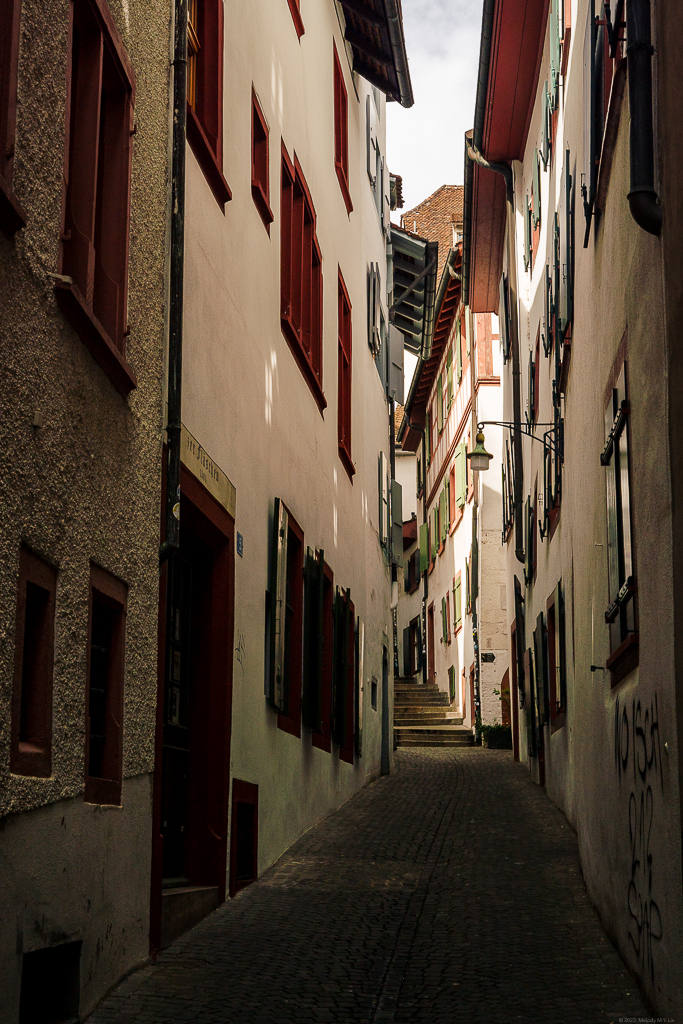 A winding alley with stairs going up and disappearing