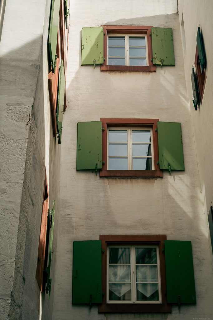 A series of identical windows vertically going down a building