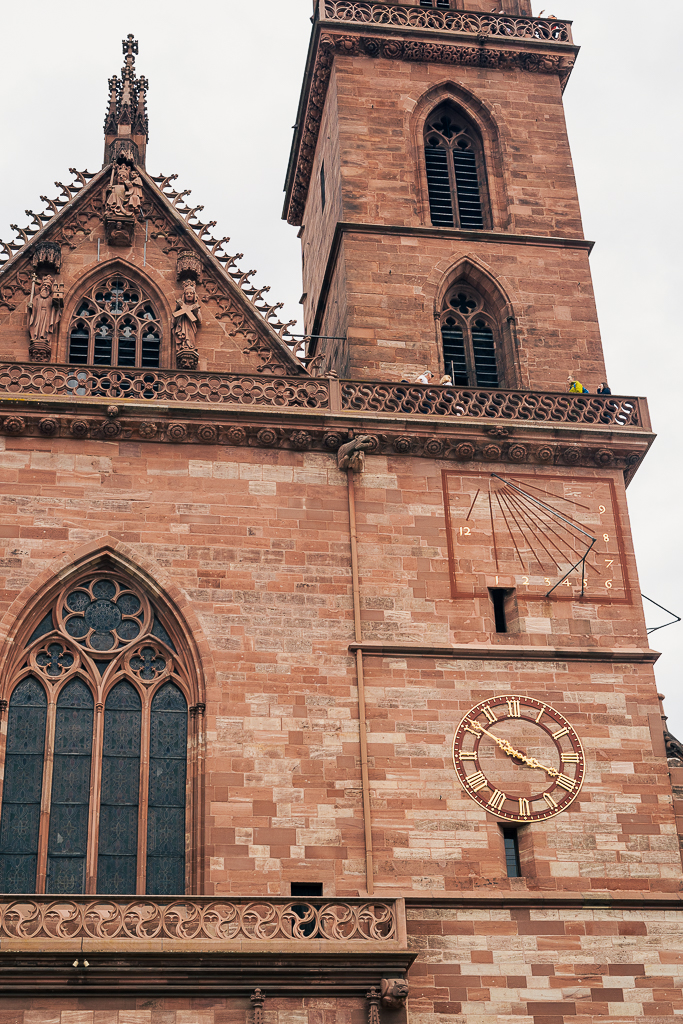 People standing on one of the high balconies on the church tower