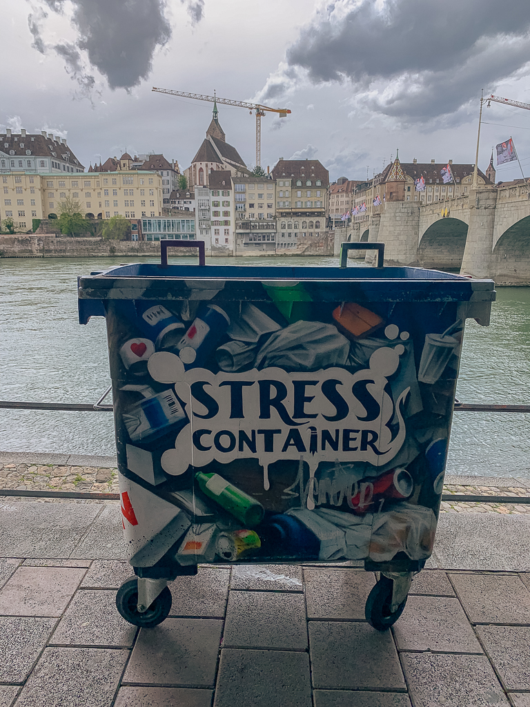 A trash bin labeled "Stress Container"