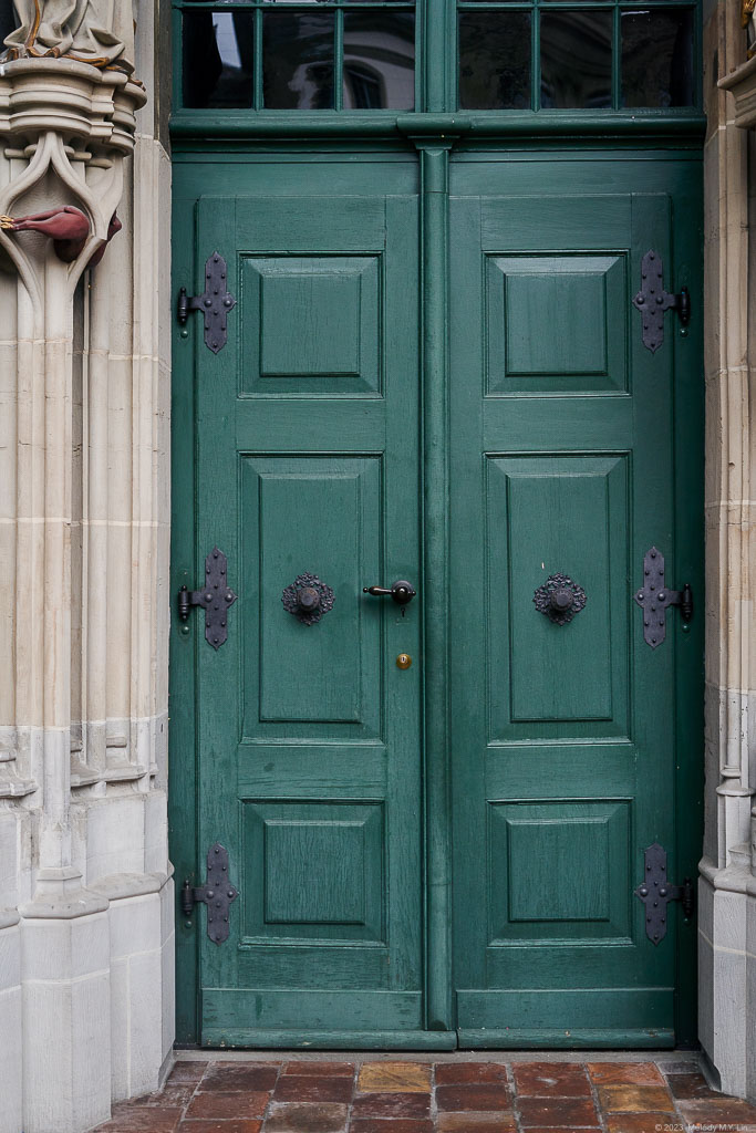 Turquoise side door of the church