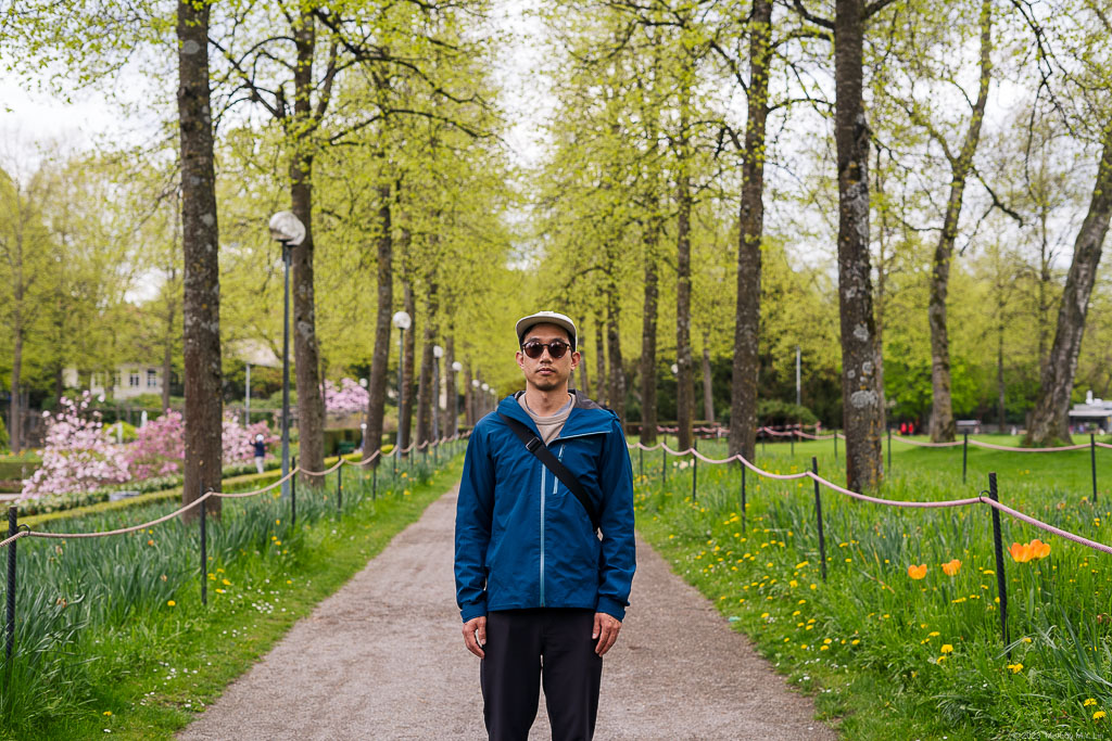 D standing in front of a grove of trees