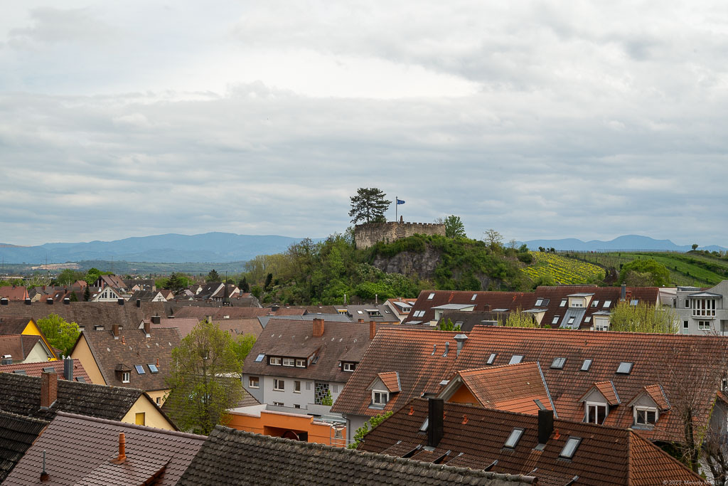 A fortress stands on a nearby hilltop.