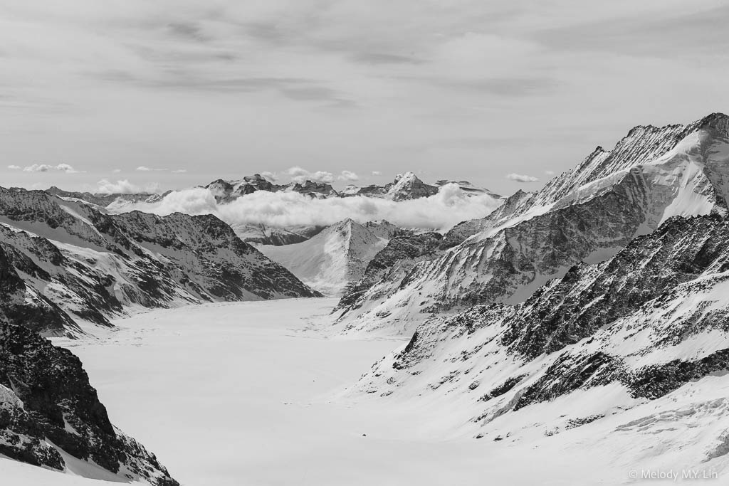 Jungfraufirn with clouds formed over peaks