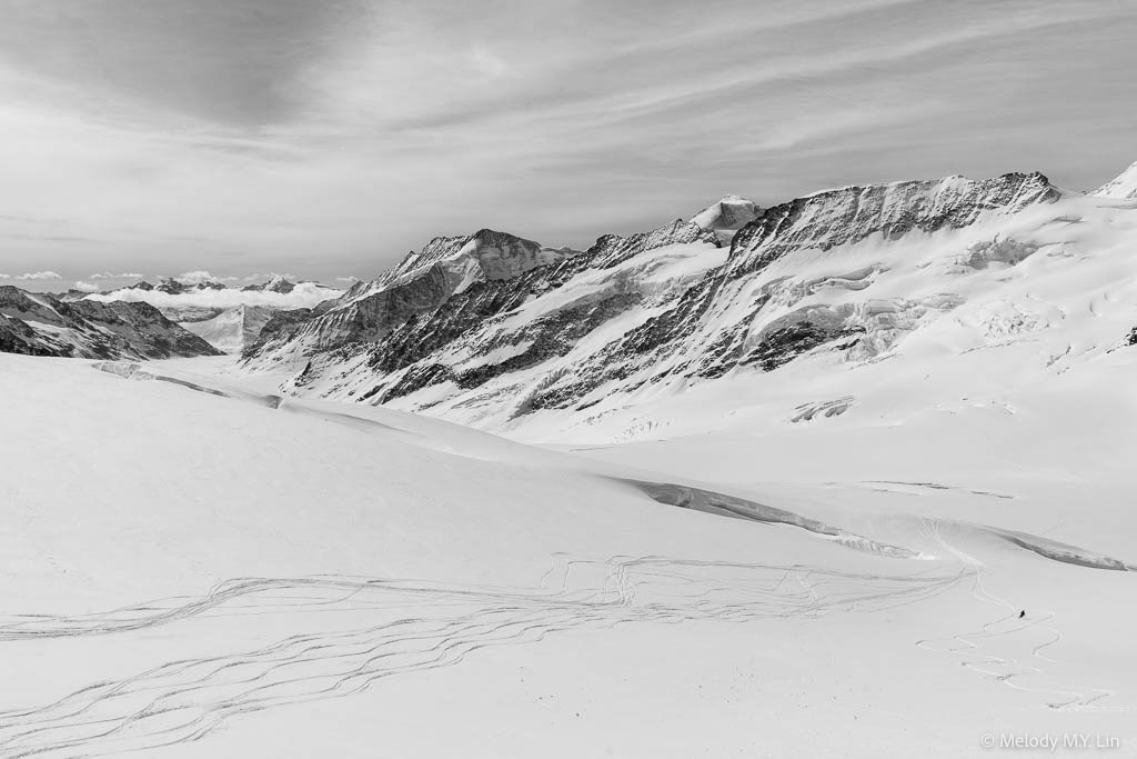 Skier zigzagging through the snow