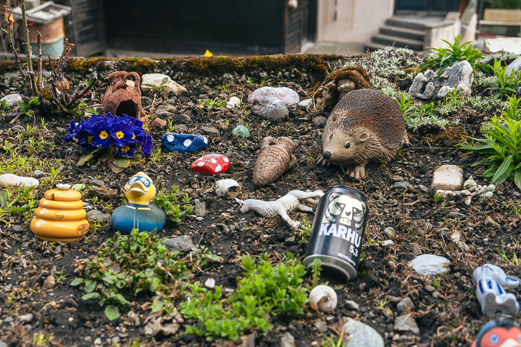 A garden bed of small treasures in the soil