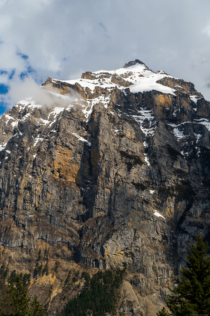 A granite wall rises above the valley