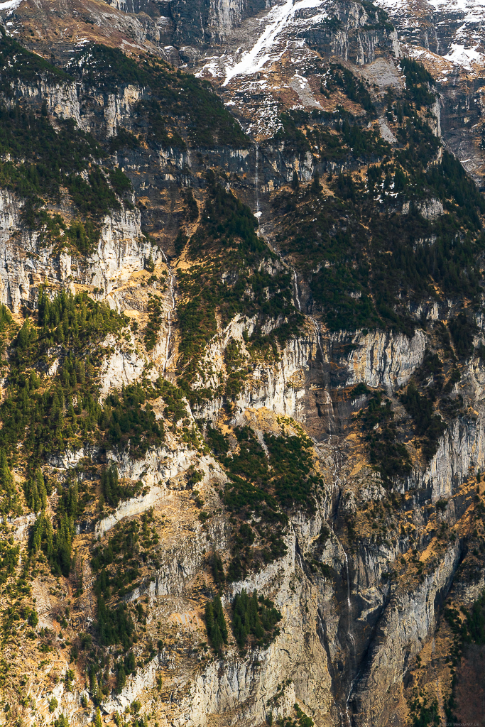 A series of waterfalls cascading down the mountainside