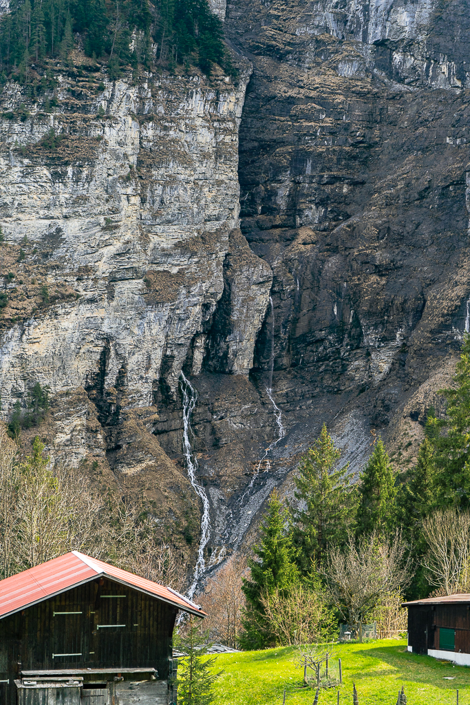 Small waterfalls coming out of a crack in the wall