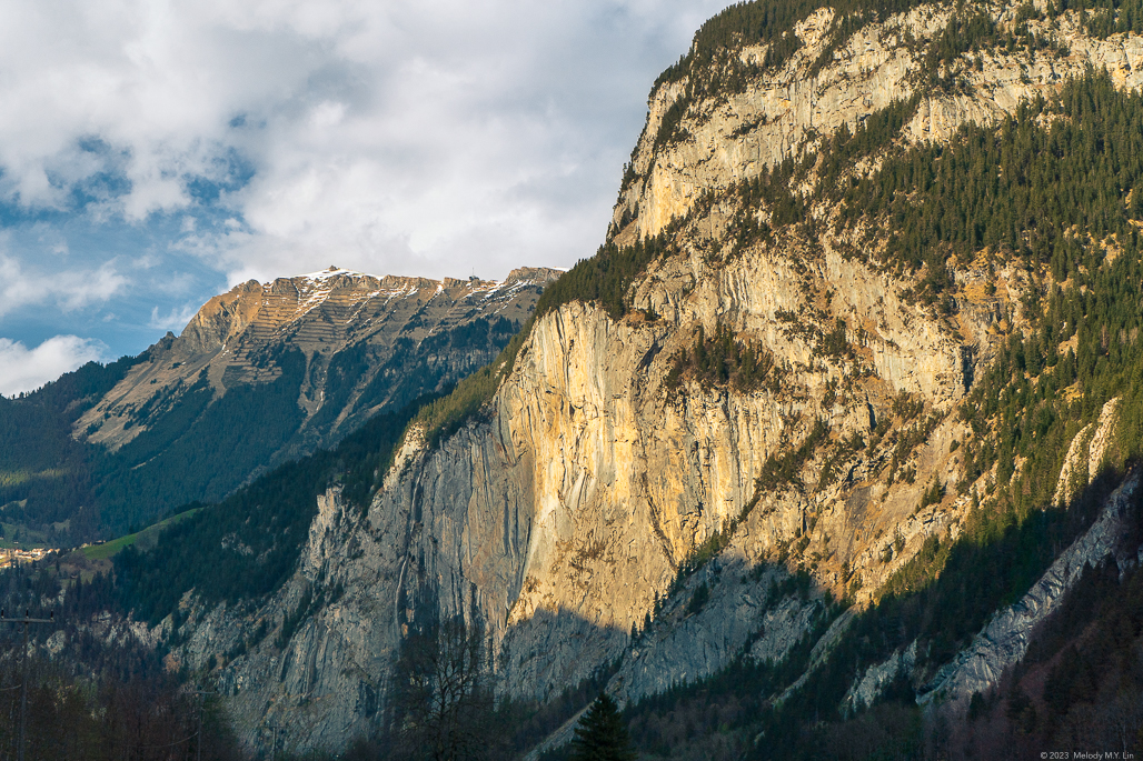 A towering cliff face at golden hour