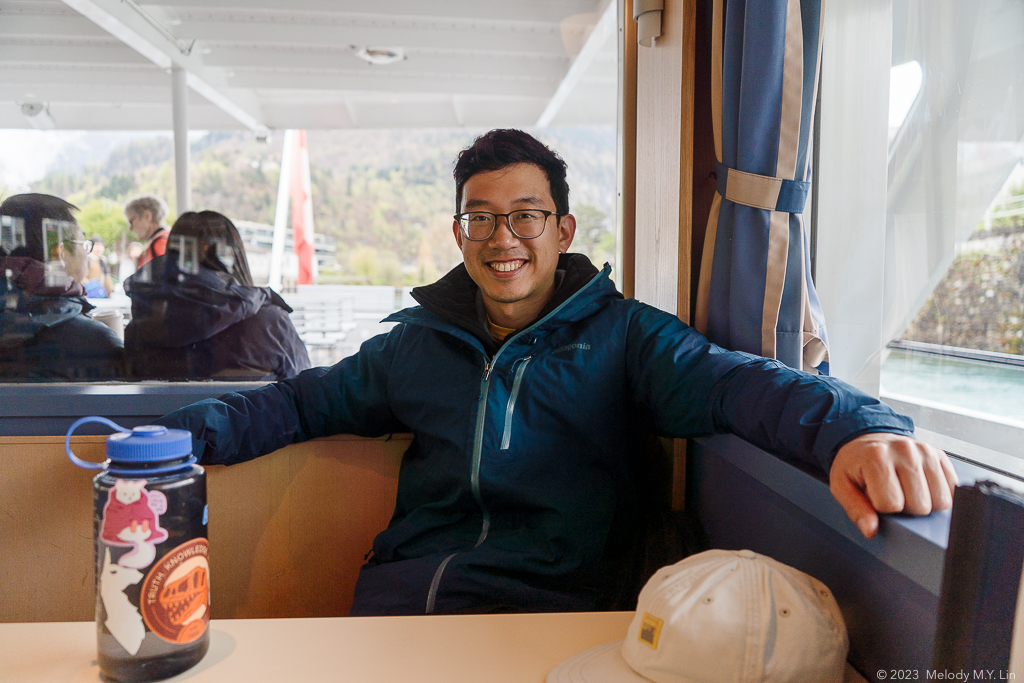 D sitting at a table on the ferry