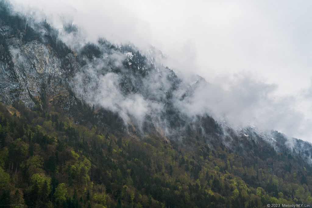 Wisps of cloud and mist lifting off the mountainside