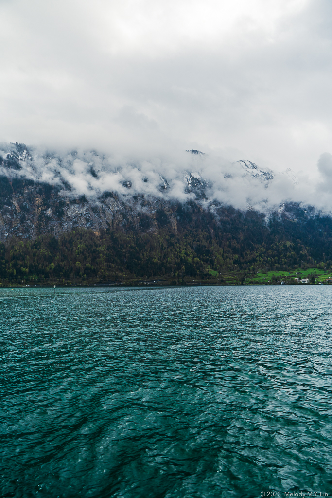 Deep, teal blue water with the mountains as backdrop