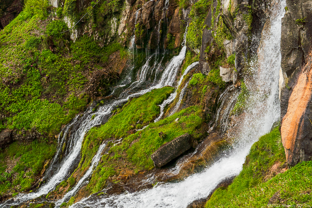 Spray from the waterfalls and green moss