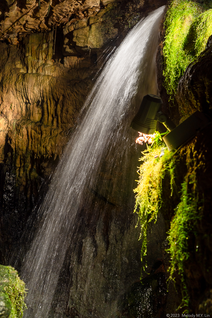 A jet of water gushes out from a crevice