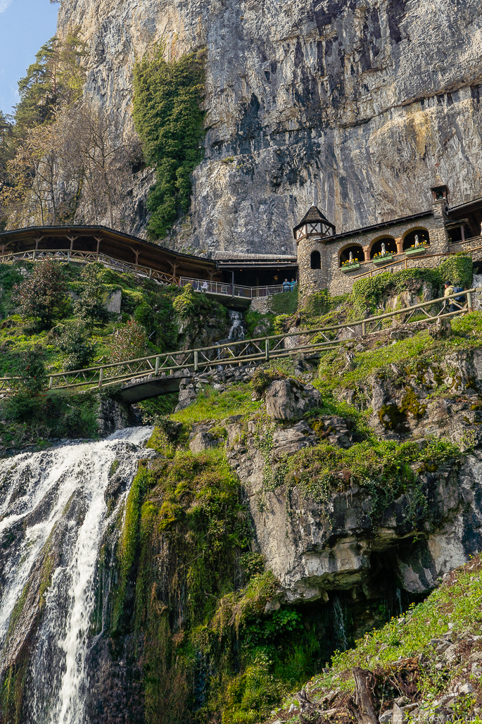 The large, granite cliffs rising above the monastery