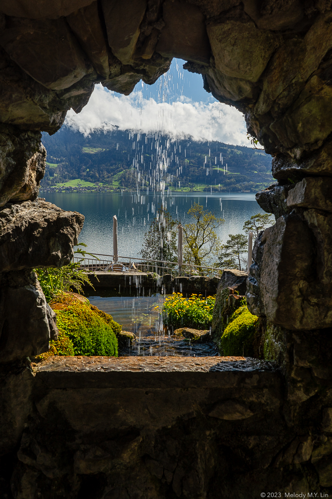 A window looks out over the lake