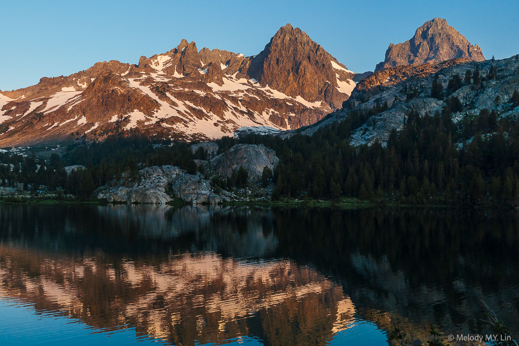 The light on the mountains turns more golden.